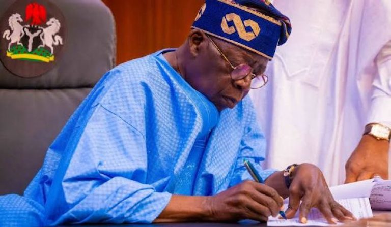 Tinubu-signs-768x447