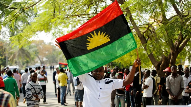 A-supporter-of-Indigenous-People-of-Biafra-IPOB-leader-Nnamdi-Kanu-holds-a-Biafra-flag-during-a-rally-in-support-of-Kanu-1536x864-1-1